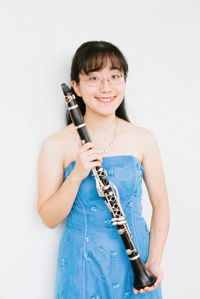 Portrait of Anna Hashimoto holding a clarinet