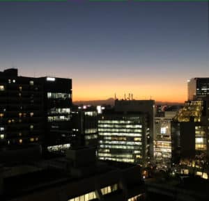 A view of Tokyo with Mt Fuji in the background against the sunset
