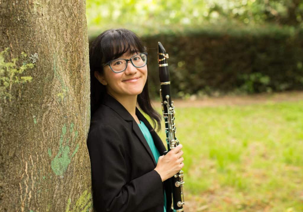 Portrait photograph of Anna Hashimoto with her clarinet