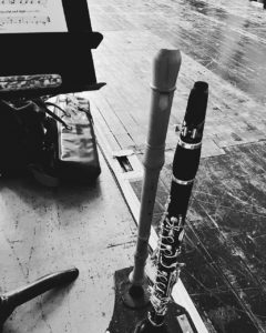 Photograph of two clarinets standing on the floor