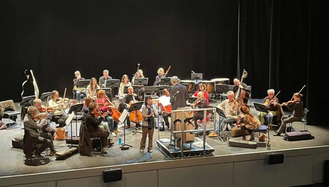 Photograph of Anna in rehearsal with the Alina Orchestra